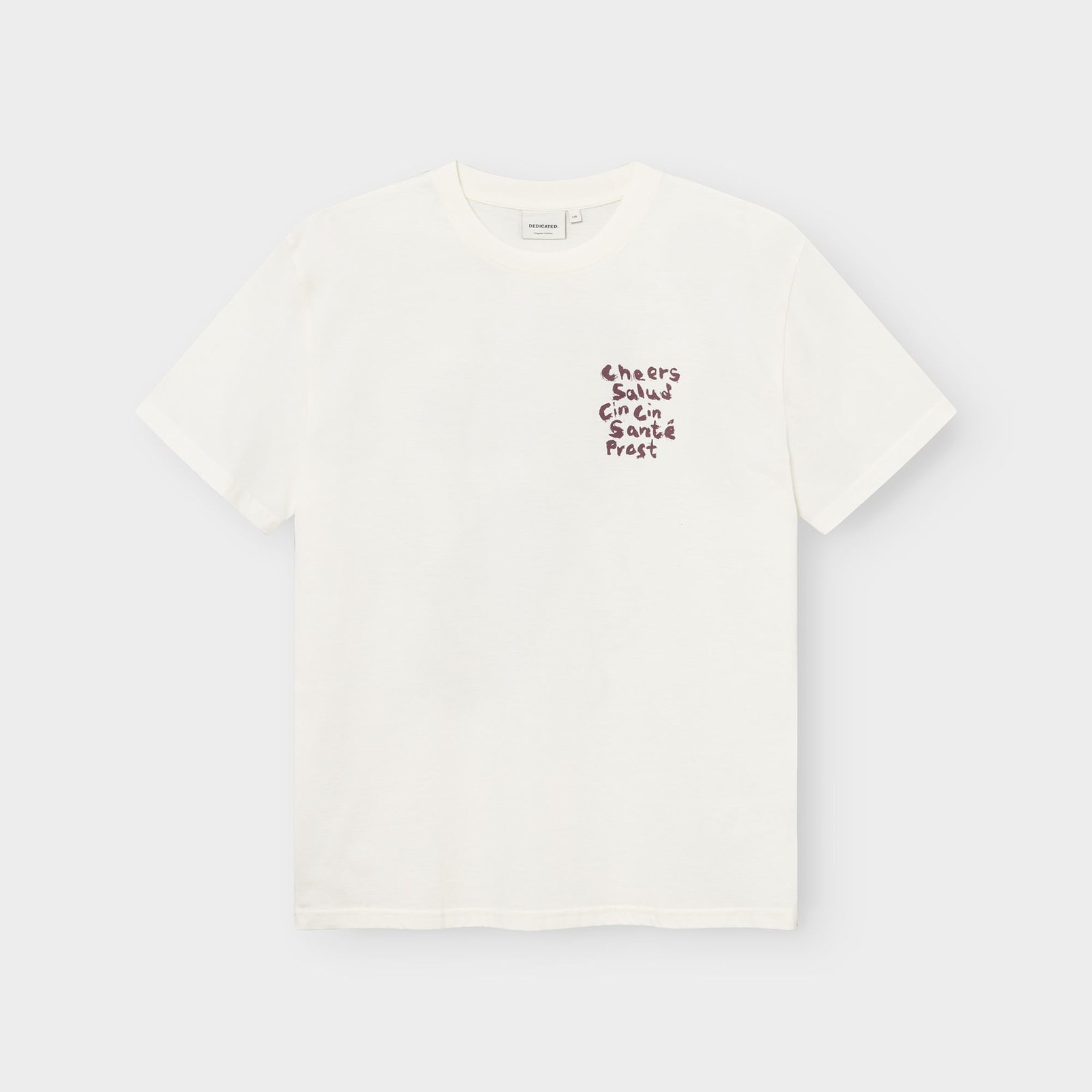 Studioaufnahme des T-Shirts Stockholm Cheers Salud in Cremeweiß mit dem Brustaufdruck „Cheers“ in verschiedenen Sprachen.