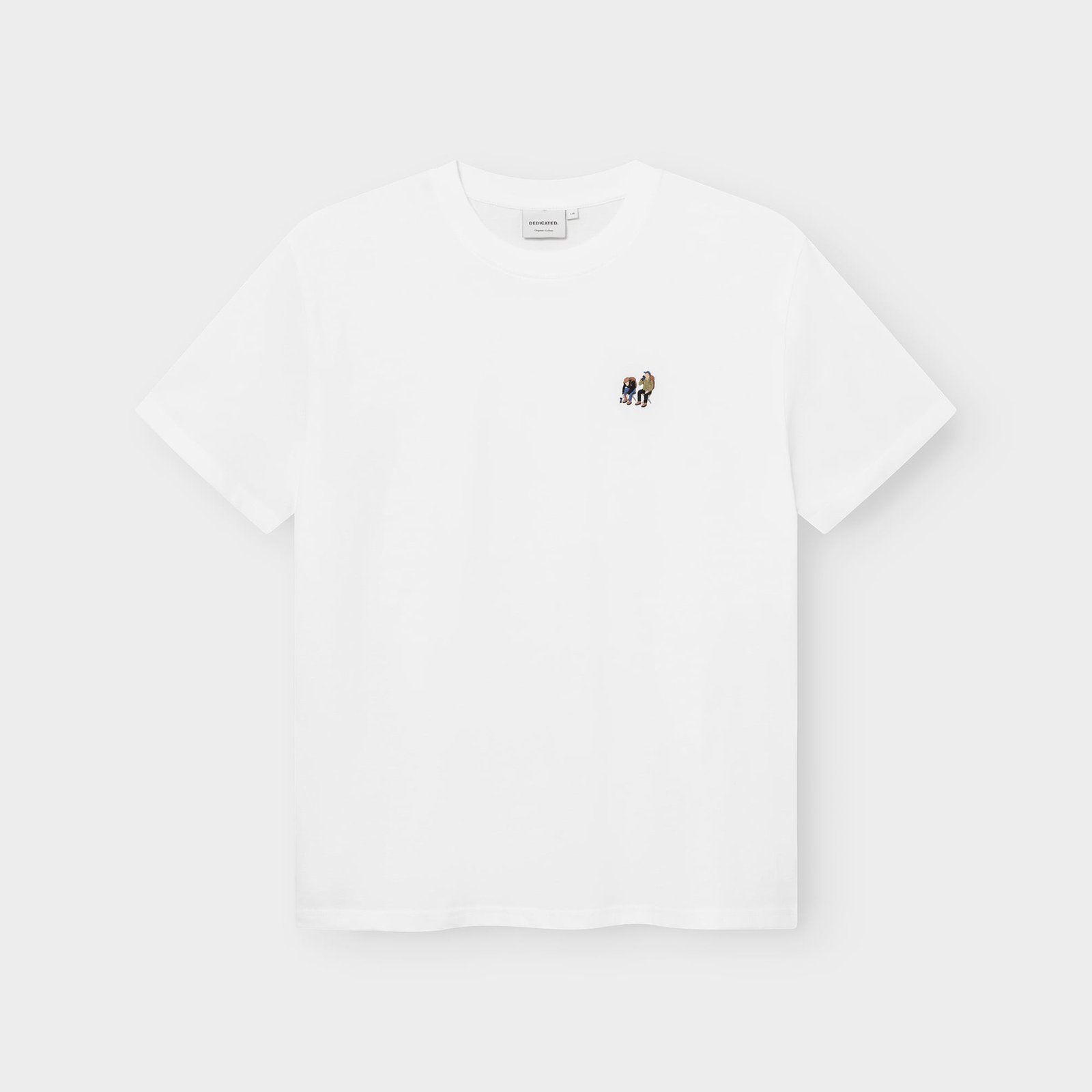 A white t-shirt, the Stockholm Camp Crew, laid flat against a grey background, showing the small embroidery on the chest.