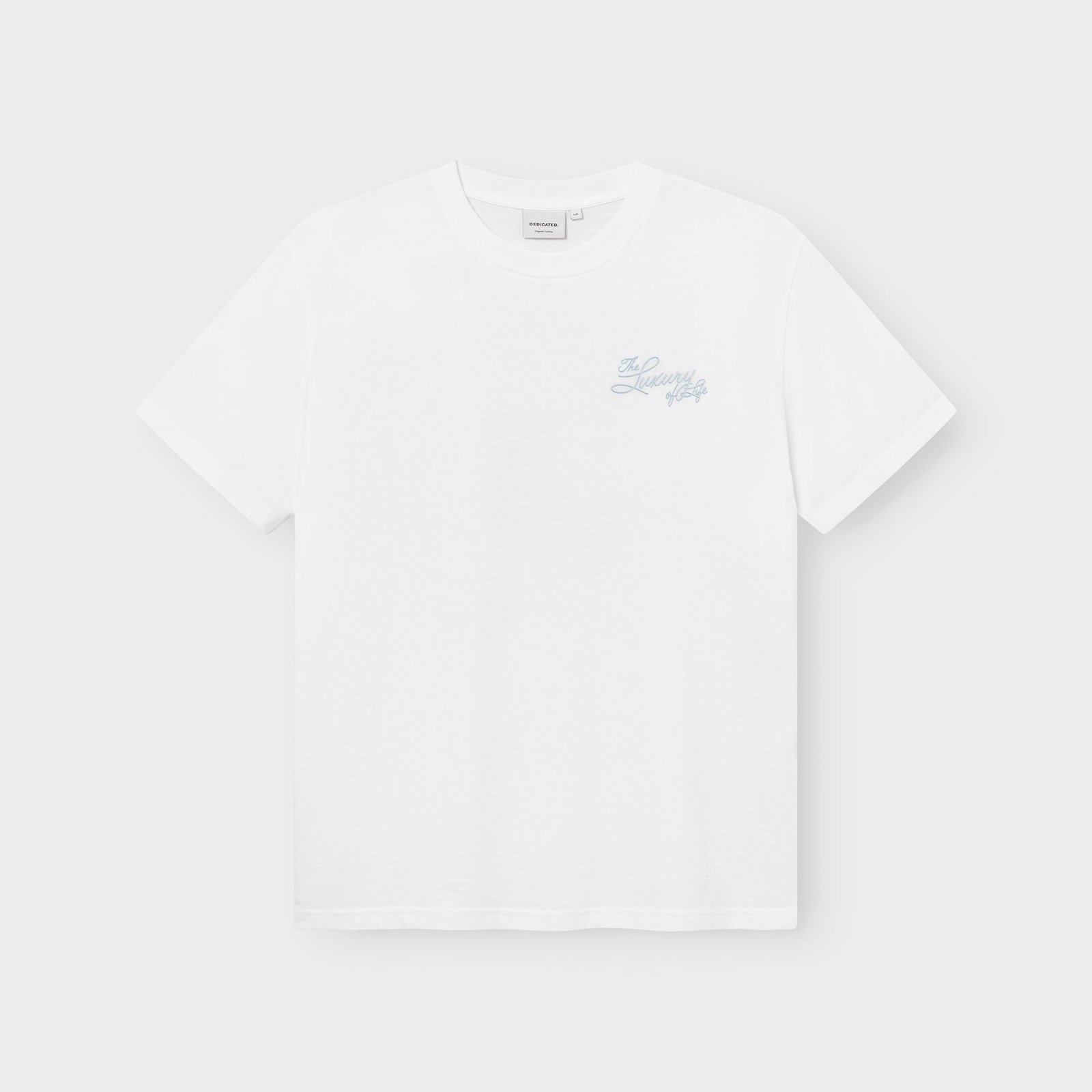 The classic white Stockholm T-shirt featuring 'The Luxury of Fondue' in a light blue script on the chest.
